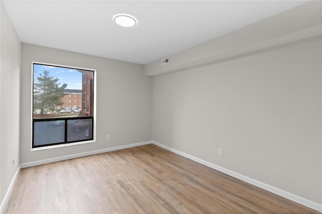 unfurnished room featuring light hardwood / wood-style flooring