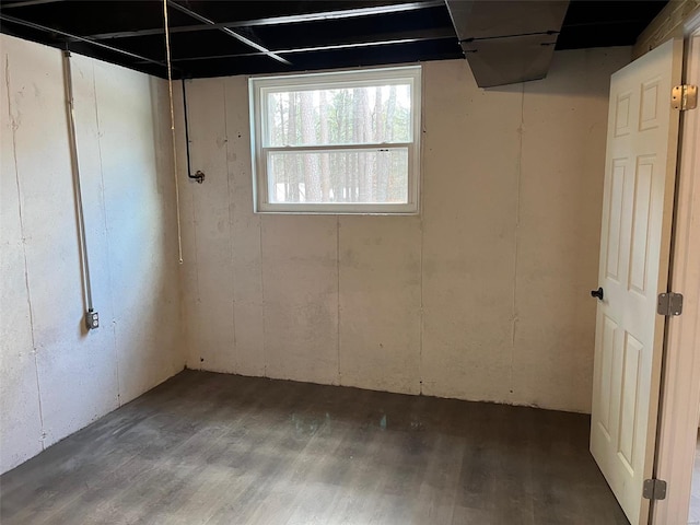 basement with hardwood / wood-style flooring