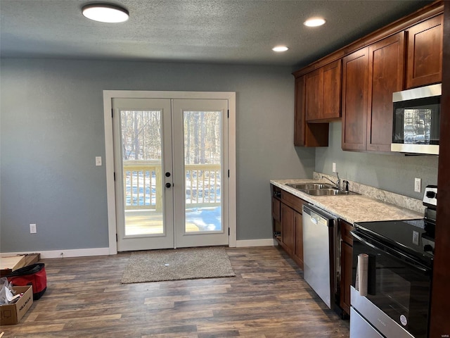 kitchen featuring sink, a wealth of natural light, french doors, and appliances with stainless steel finishes