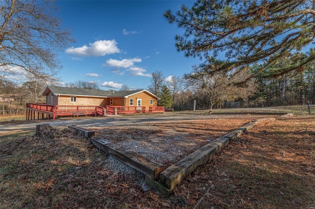 exterior space featuring a wooden deck