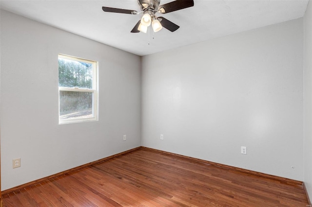 unfurnished room with ceiling fan and wood-type flooring