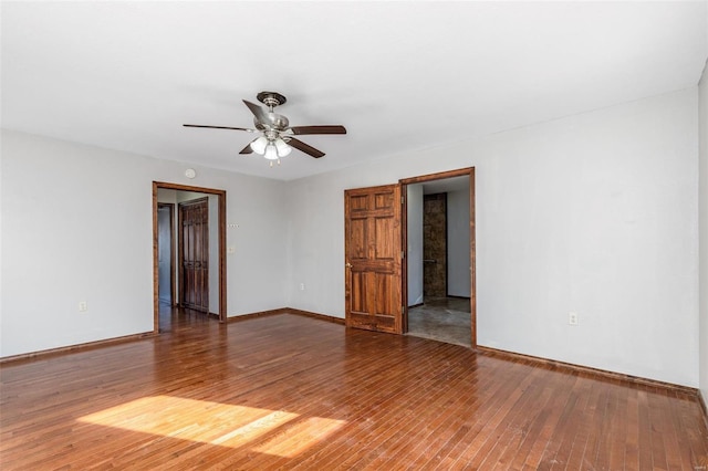 unfurnished room with ceiling fan and wood-type flooring