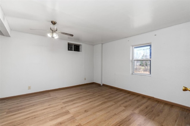 unfurnished room featuring light hardwood / wood-style flooring and ceiling fan