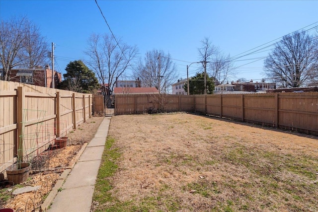 view of yard with a fenced backyard