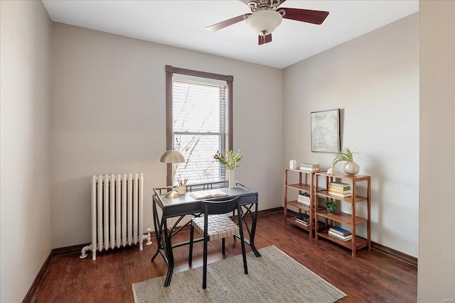 office area with radiator, baseboards, and wood finished floors