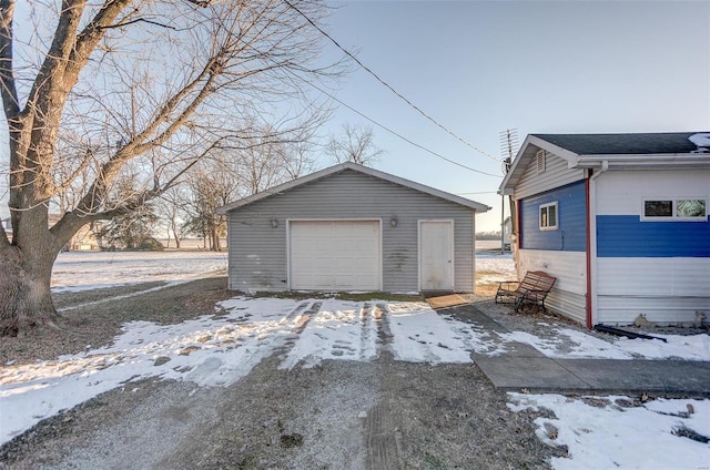 view of snow covered garage