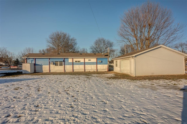 back of property featuring a garage