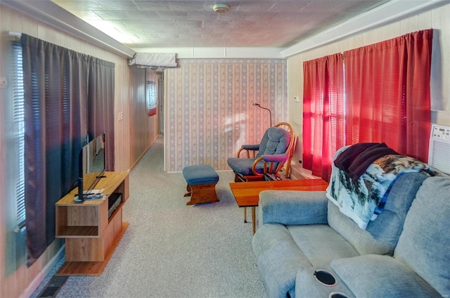 living room featuring carpet flooring and wooden walls