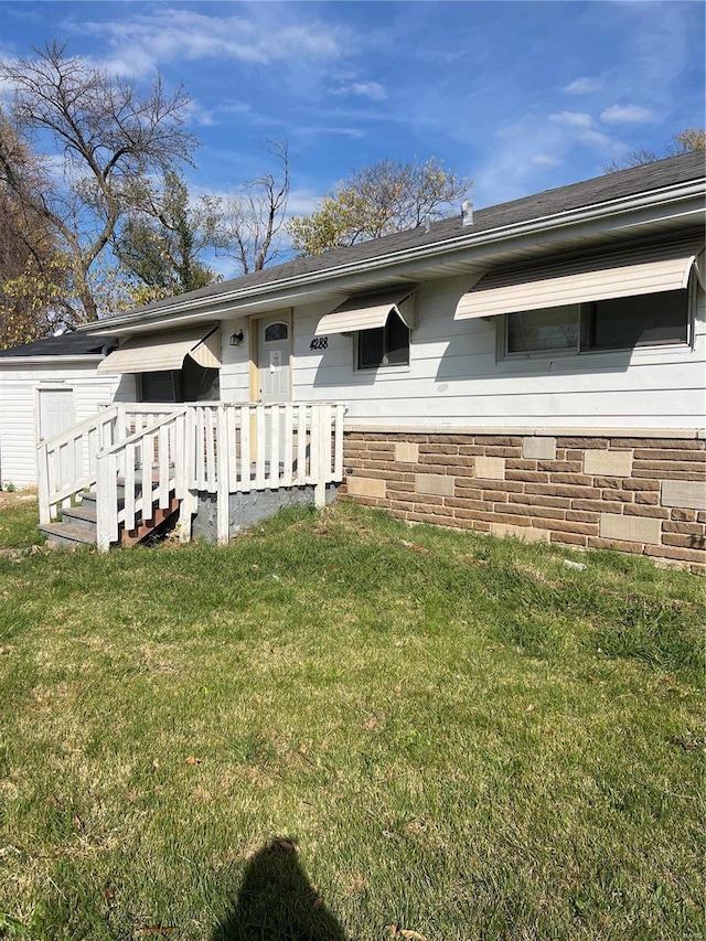 exterior space featuring a front lawn