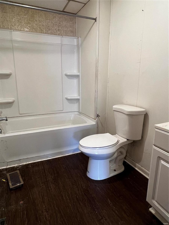 full bathroom with vanity, hardwood / wood-style floors, bathing tub / shower combination, and toilet