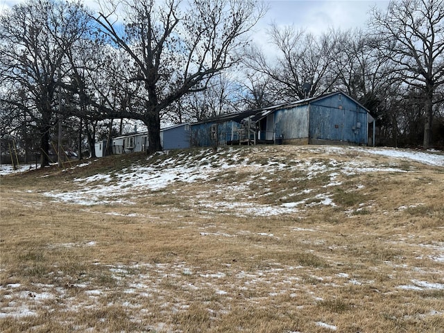 view of yard layered in snow