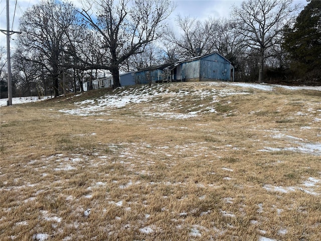 view of yard layered in snow