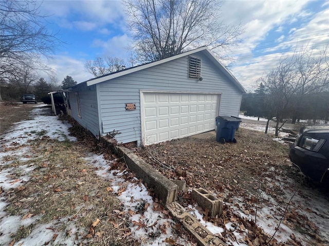 view of snow covered garage