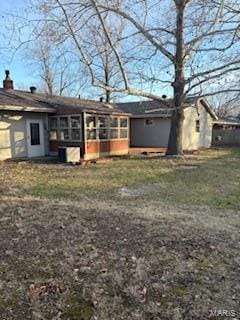 rear view of house with a sunroom