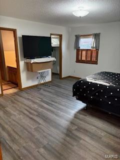 unfurnished bedroom with wood-type flooring