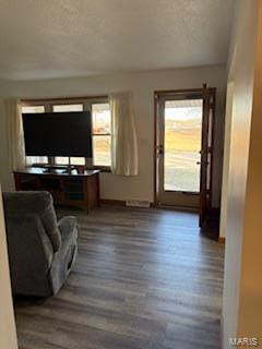 living room with dark wood-type flooring