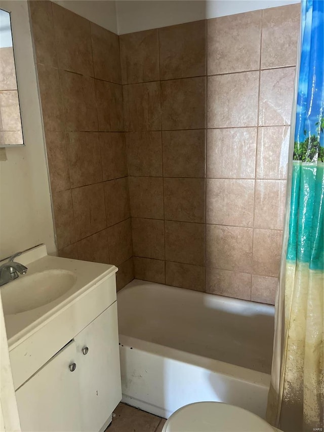 full bathroom with toilet, vanity, and shower / tub combo with curtain