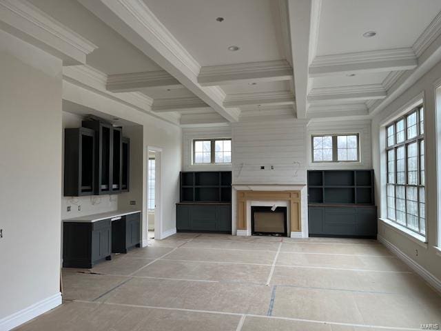 unfurnished living room featuring crown molding, coffered ceiling, and beam ceiling