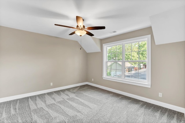 additional living space with visible vents, baseboards, carpet floors, lofted ceiling, and ceiling fan