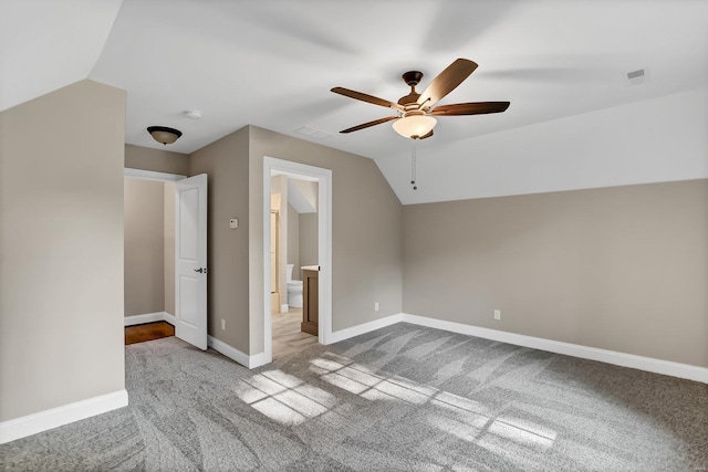 bonus room with visible vents, lofted ceiling, carpet floors, baseboards, and ceiling fan