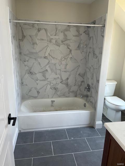 bathroom featuring vanity, bathing tub / shower combination, toilet, and tile patterned flooring