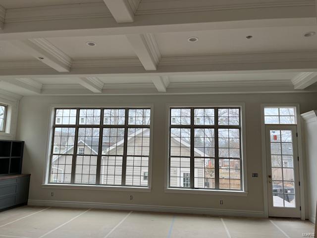 doorway with baseboards, beam ceiling, coffered ceiling, and crown molding