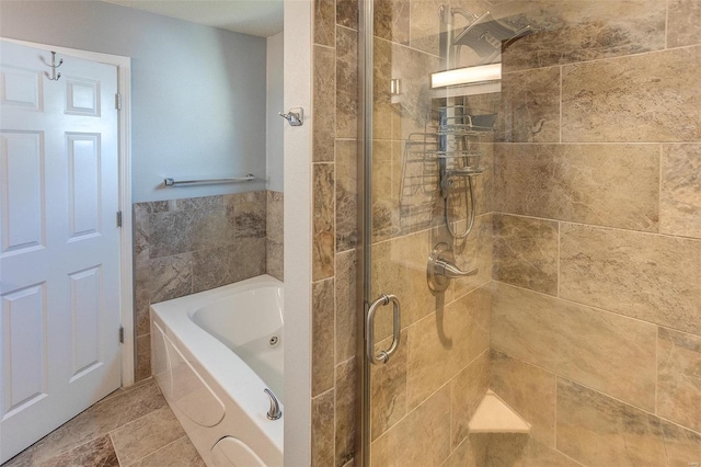 bathroom with separate shower and tub