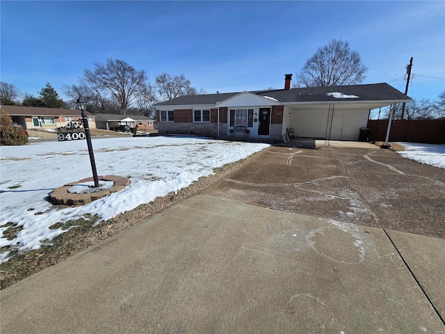 ranch-style house with a carport