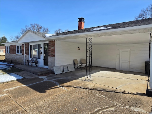 view of front of house with a carport