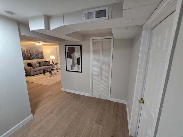 hall with light hardwood / wood-style floors