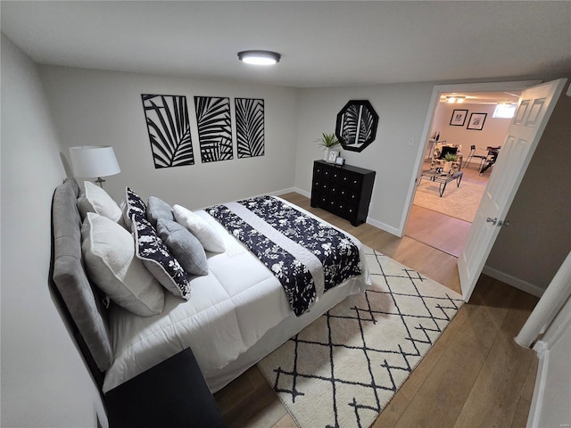 bedroom with hardwood / wood-style floors