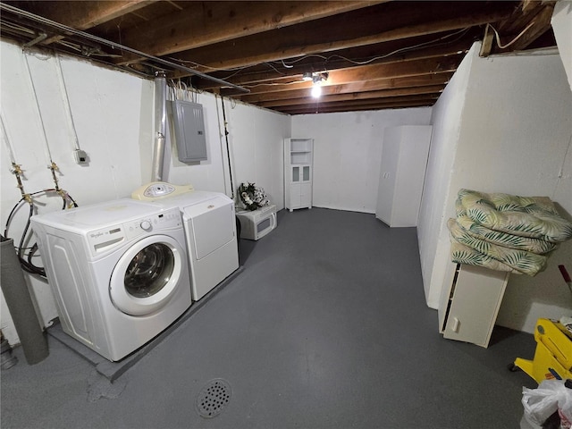 clothes washing area featuring washing machine and clothes dryer and electric panel