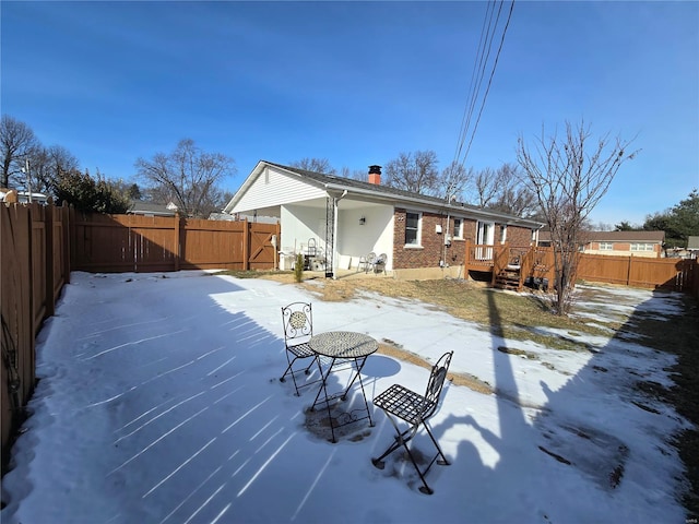 view of snow covered house