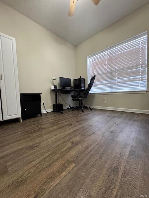 home office with ceiling fan and dark hardwood / wood-style floors