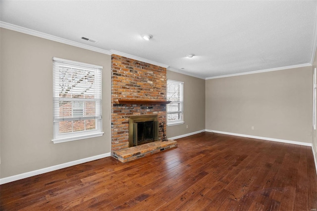 unfurnished living room featuring crown molding, a fireplace, and dark hardwood / wood-style flooring