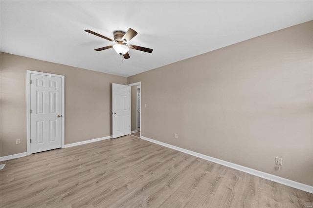 unfurnished bedroom with ceiling fan, light hardwood / wood-style floors, and a closet