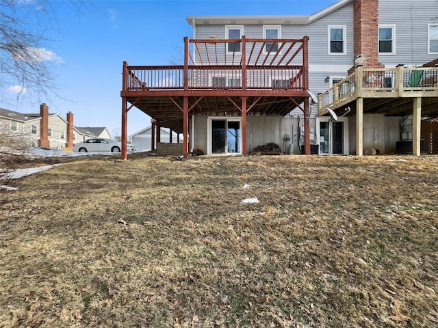 back of property with a wooden deck