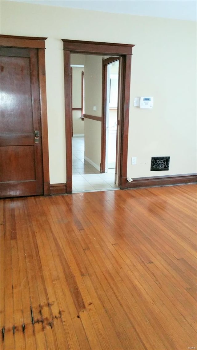 empty room with light wood-type flooring