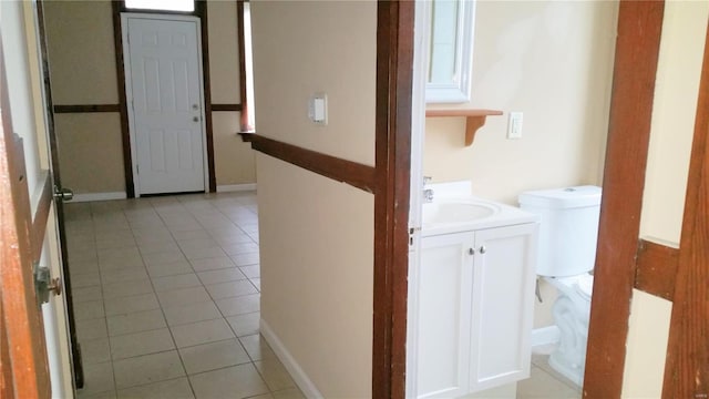 interior space featuring sink and light tile patterned floors