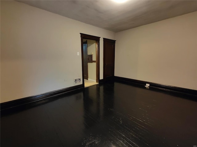 empty room featuring hardwood / wood-style flooring