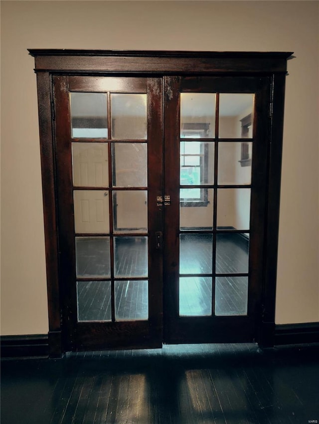 room details with hardwood / wood-style floors and french doors