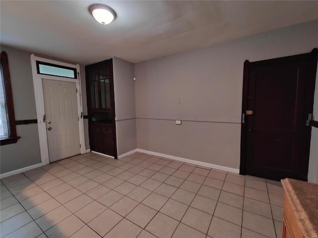 foyer entrance featuring light tile patterned flooring