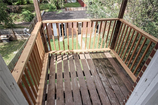 wooden deck with a yard