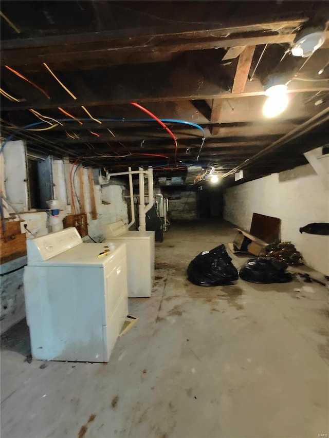 basement with washing machine and clothes dryer