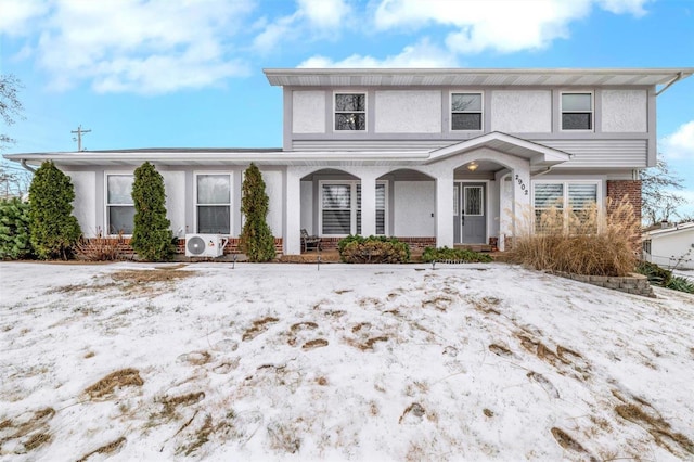 view of front property with ac unit