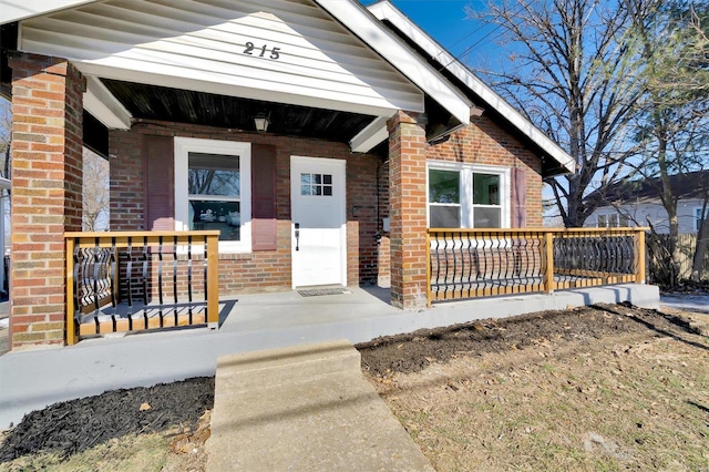 entrance to property featuring a porch