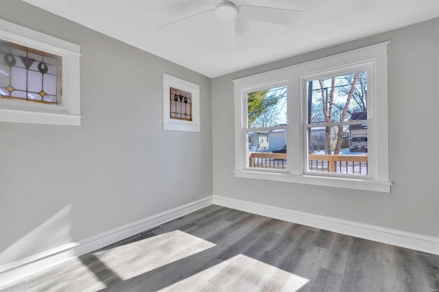 spare room with ceiling fan and hardwood / wood-style floors