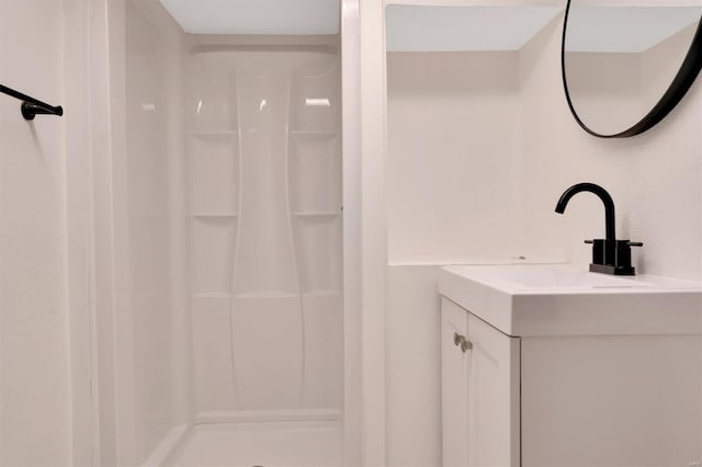 bathroom featuring sink and walk in shower