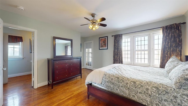 bedroom featuring wood-type flooring and ceiling fan