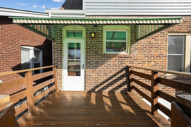 entrance to property with a wooden deck